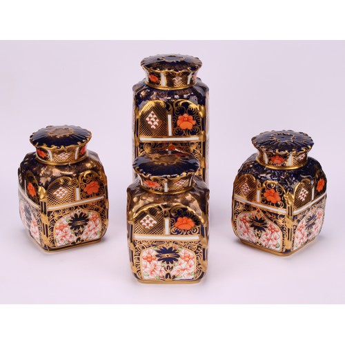 235 - A set of three Royal Crown Derby 1128 pattern shaped rectangular caddies, shaped circular covers, 10... 