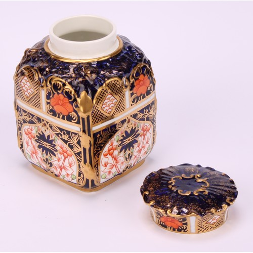 235 - A set of three Royal Crown Derby 1128 pattern shaped rectangular caddies, shaped circular covers, 10... 