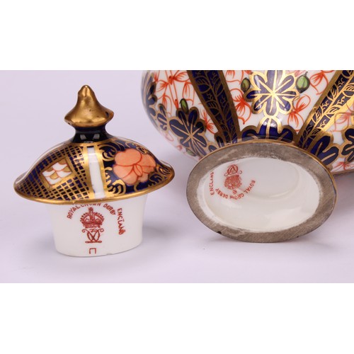 239 - An associated pair of Royal Crown Derby 1128 Imari pattern flattened ovoid pedestal vases, oval dome... 