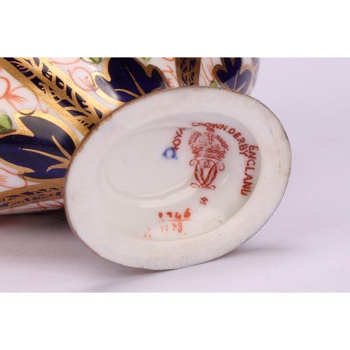 239 - An associated pair of Royal Crown Derby 1128 Imari pattern flattened ovoid pedestal vases, oval dome... 