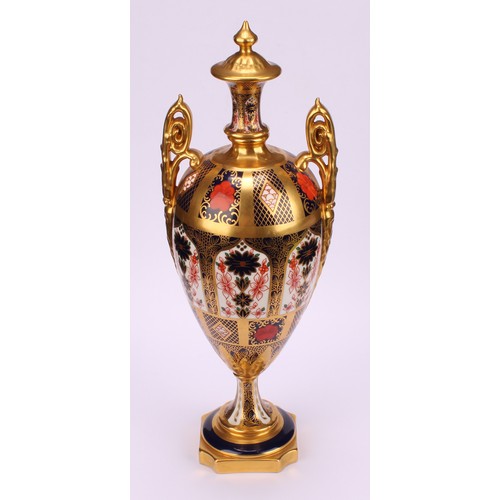 226 - A Royal Crown Derby Imari 1128 pattern two handled pedestal vase and cover, solid gold band, first q... 