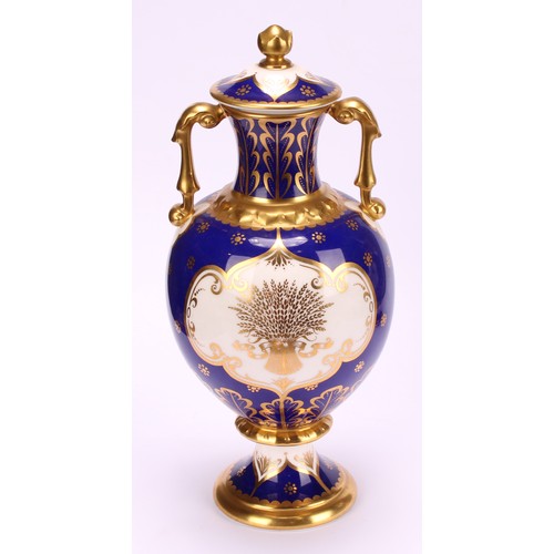 203 - A pair of Royal Crown Derby pedestal ovoid two handled vases and covers, The Chatsworth Vase and The... 