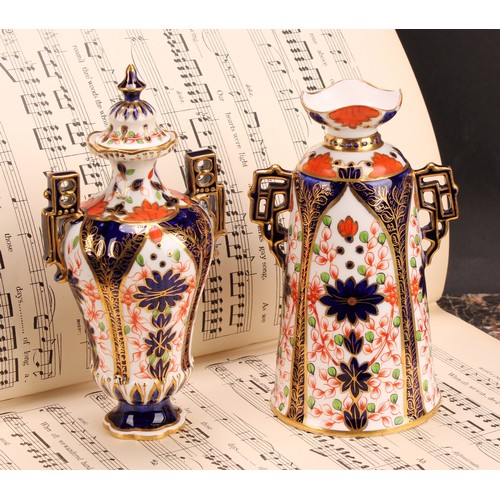 228 - A Royal Crown Derby Imari elongated ogee shaped two-handled vase and cover, Japanesque angular handl... 