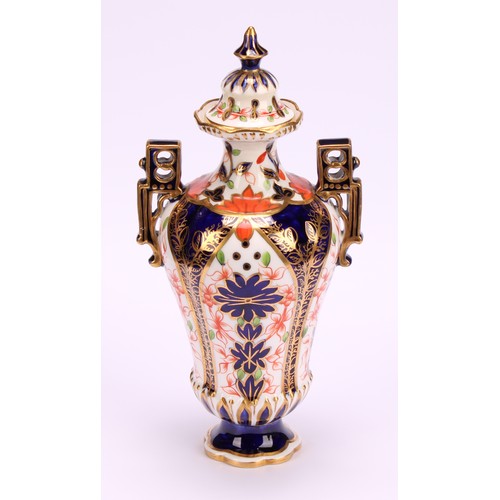 228 - A Royal Crown Derby Imari elongated ogee shaped two-handled vase and cover, Japanesque angular handl... 