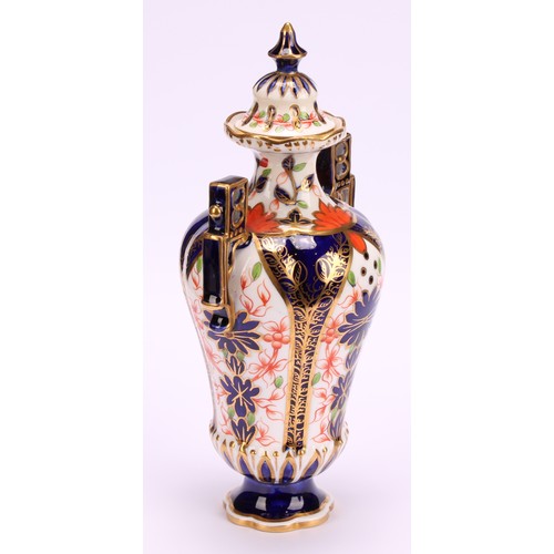 228 - A Royal Crown Derby Imari elongated ogee shaped two-handled vase and cover, Japanesque angular handl... 