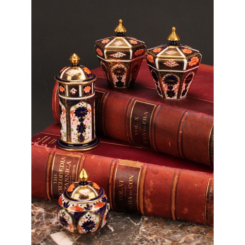 245 - An associated pair of Royal Crown Derby 1128 Imari pattern tapered hexagonal jars and covers, 10cm h... 