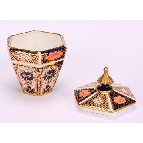 245 - An associated pair of Royal Crown Derby 1128 Imari pattern tapered hexagonal jars and covers, 10cm h... 