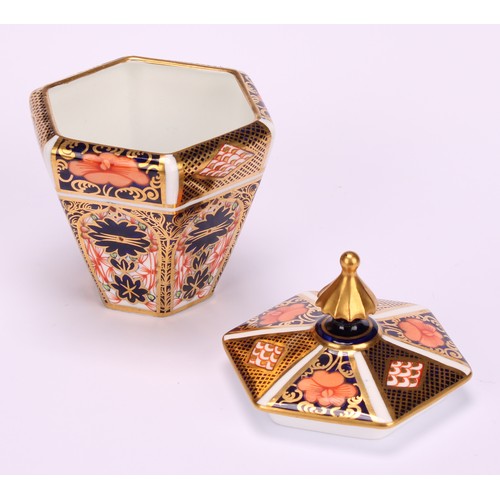 245 - An associated pair of Royal Crown Derby 1128 Imari pattern tapered hexagonal jars and covers, 10cm h... 