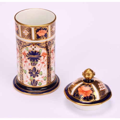 245 - An associated pair of Royal Crown Derby 1128 Imari pattern tapered hexagonal jars and covers, 10cm h... 