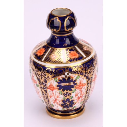 217 - A Royal Crown Derby 1128 Imari pattern two-handled bottle vase, of conical form, swan neck handles, ... 