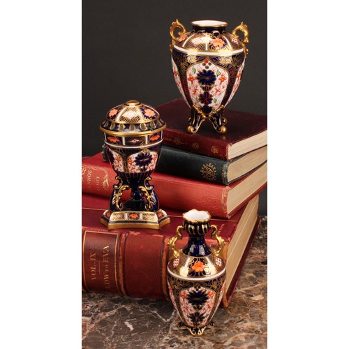 207 - A Royal Crown Derby 1128 Imari pattern flattened ovoid two-handled vase, rococo style handles, four ... 