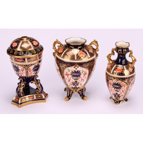 207 - A Royal Crown Derby 1128 Imari pattern flattened ovoid two-handled vase, rococo style handles, four ... 