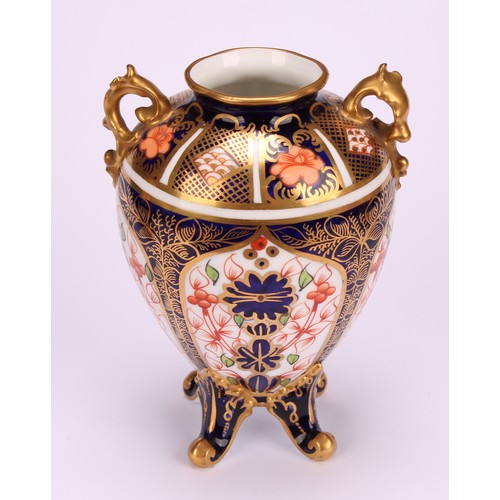 207 - A Royal Crown Derby 1128 Imari pattern flattened ovoid two-handled vase, rococo style handles, four ... 