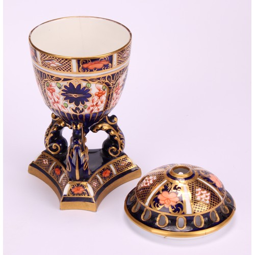 207 - A Royal Crown Derby 1128 Imari pattern flattened ovoid two-handled vase, rococo style handles, four ... 