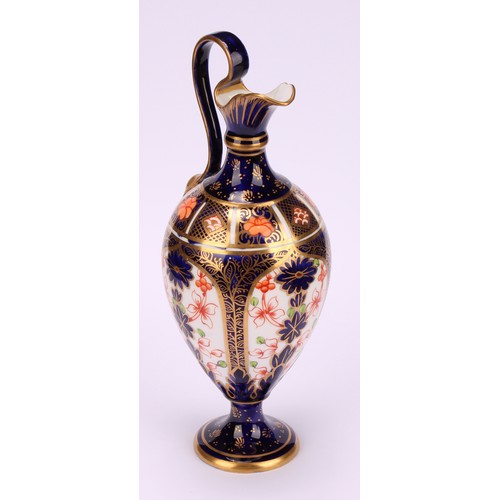 212 - A Royal Crown Derby 1128 Imari pattern pedestal ewer, scroll handle with mask terminal, circular bas... 