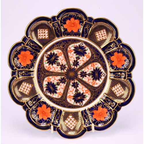 209 - A Royal Crown Derby 1128 Imari pattern lobed circular plate, shaped moulded borders, 22.5cm diameter... 