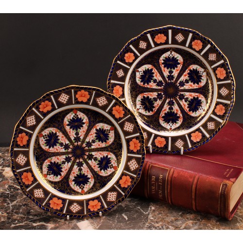 246 - An associated pair of Royal Crown Derby Imari pattern shaped circular plates, gadrooned borders, 22.... 