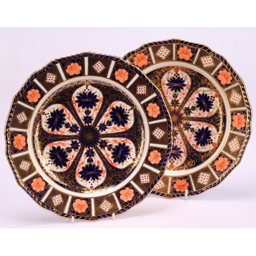 246 - An associated pair of Royal Crown Derby Imari pattern shaped circular plates, gadrooned borders, 22.... 