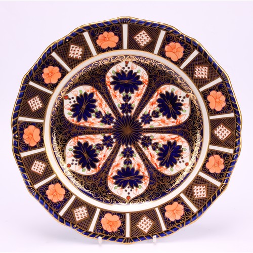 246 - An associated pair of Royal Crown Derby Imari pattern shaped circular plates, gadrooned borders, 22.... 