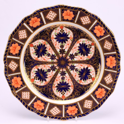 246 - An associated pair of Royal Crown Derby Imari pattern shaped circular plates, gadrooned borders, 22.... 