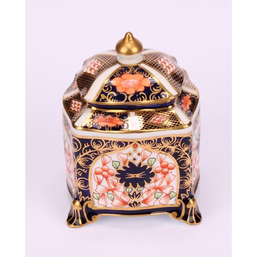 213 - A Royal Crown Derby 1128 Imari pattern shaped square inkwell, of casket form, the domed cover enclos... 