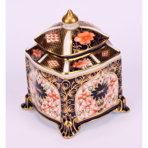 213 - A Royal Crown Derby 1128 Imari pattern shaped square inkwell, of casket form, the domed cover enclos... 