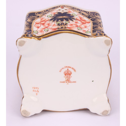 213 - A Royal Crown Derby 1128 Imari pattern shaped square inkwell, of casket form, the domed cover enclos... 