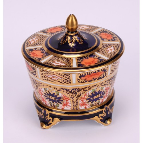 214 - A Royal Crown Derby 1128 Imari pattern tapered circular box and cover, the cover slightly domed, fou... 