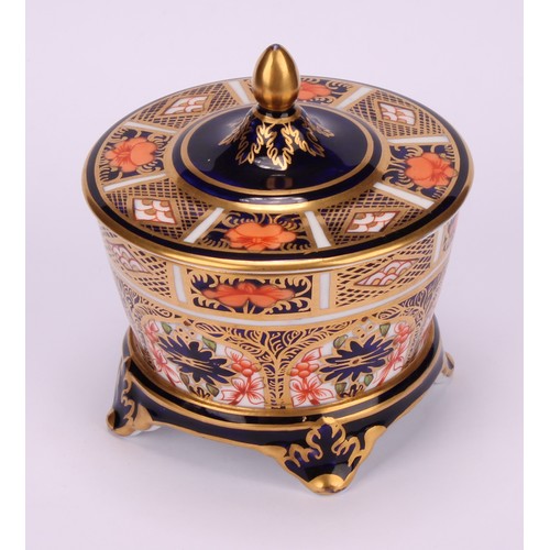 214 - A Royal Crown Derby 1128 Imari pattern tapered circular box and cover, the cover slightly domed, fou... 