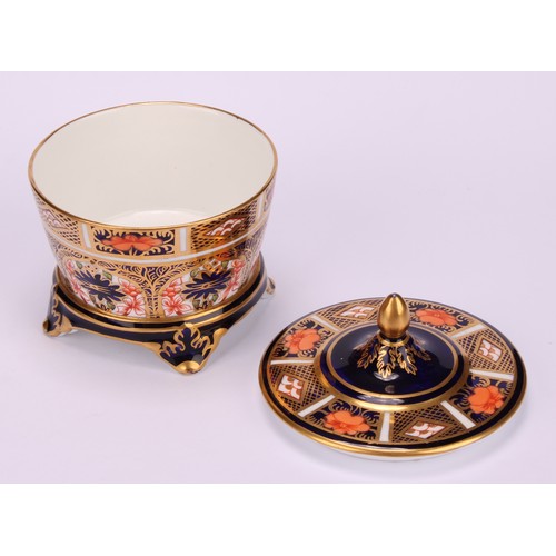 214 - A Royal Crown Derby 1128 Imari pattern tapered circular box and cover, the cover slightly domed, fou... 