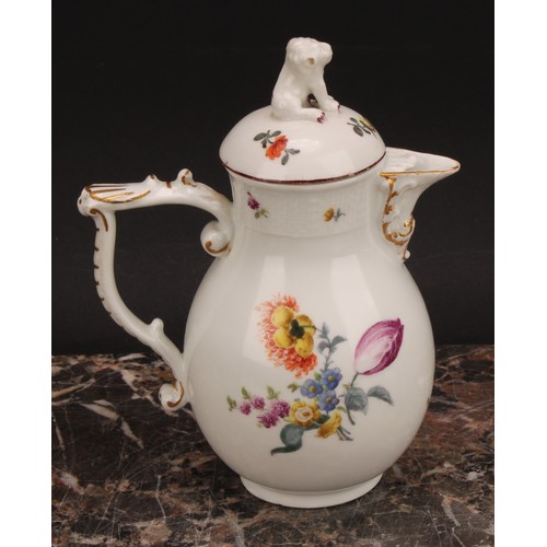 278 - A mid 18th century Meissen baluster jug and cover, painted with flowers, moulded basket weave border... 