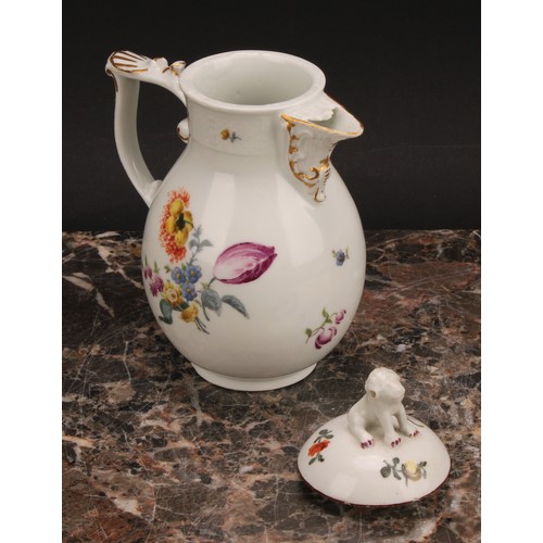 278 - A mid 18th century Meissen baluster jug and cover, painted with flowers, moulded basket weave border... 