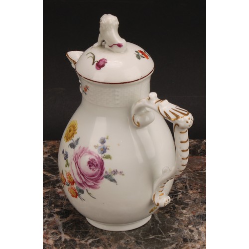 278 - A mid 18th century Meissen baluster jug and cover, painted with flowers, moulded basket weave border... 