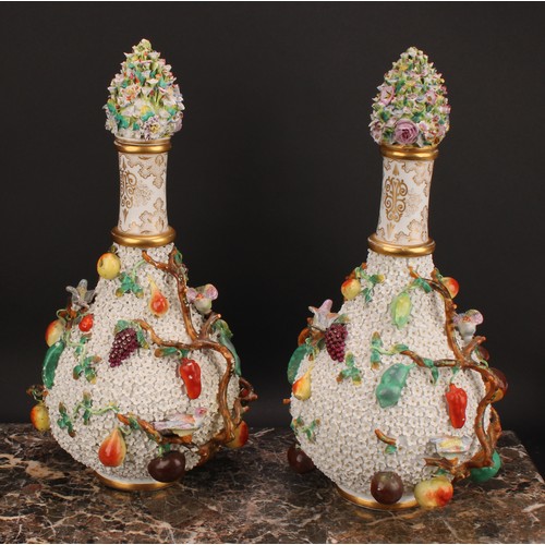 287 - A pair of Meissen schneeballen bottle vases and covers, typically encrusted and applied with birds a... 