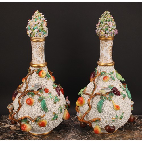 287 - A pair of Meissen schneeballen bottle vases and covers, typically encrusted and applied with birds a... 