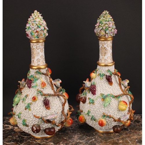 287 - A pair of Meissen schneeballen bottle vases and covers, typically encrusted and applied with birds a... 