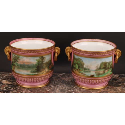 285 - A pair of French porcelain ice pails or jardinieres, painted with courting putti, with river landsca... 