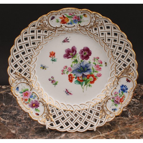 292 - A set of six German porcelain shaped circular plates, decorated with flowers, pierced borders picked... 