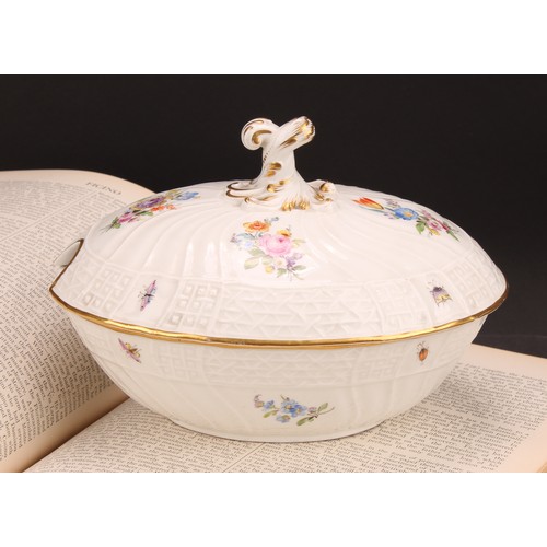 273 - A German porcelain oval tureen and cover, moulded with flutes and diapers and decorated in polychrom... 