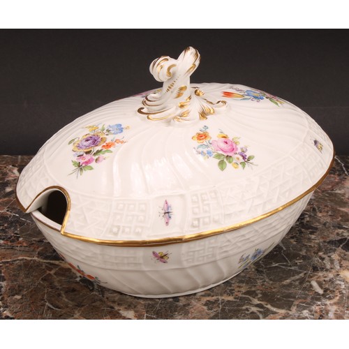 273 - A German porcelain oval tureen and cover, moulded with flutes and diapers and decorated in polychrom... 