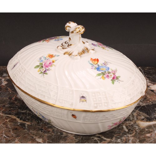 273 - A German porcelain oval tureen and cover, moulded with flutes and diapers and decorated in polychrom... 