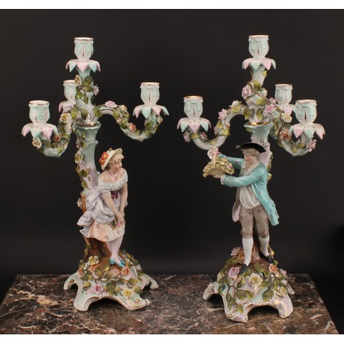 289 - A pair of Sitzendorf figural four-light candelabra, modelled as a courting couple, each painted in p... 