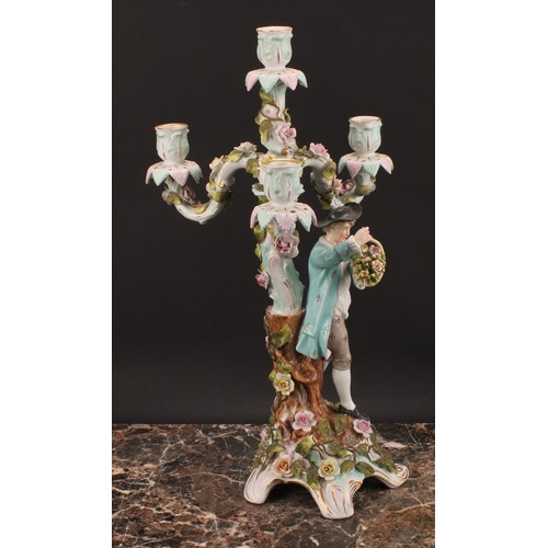 289 - A pair of Sitzendorf figural four-light candelabra, modelled as a courting couple, each painted in p... 