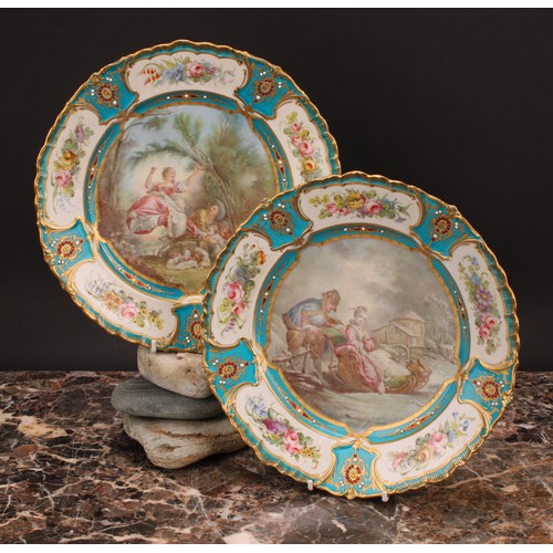 288 - A pair of Sevres shaped circular plates, painted by L Vergniaud, signed, with a courting couple in a... 