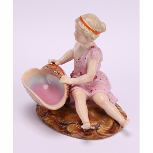 282 - A pair of 19th century Sitzendorf figural table salts, of children holding seashells, decorated in p... 