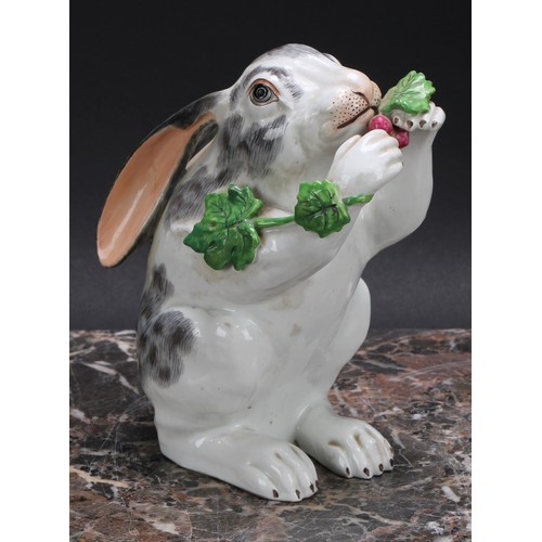 268 - A Continental porcelain model, of a rabbit, on hind legs eating grapes from a vine, 15.5cm high, c.1... 