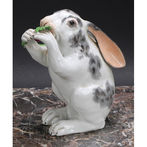 268 - A Continental porcelain model, of a rabbit, on hind legs eating grapes from a vine, 15.5cm high, c.1... 