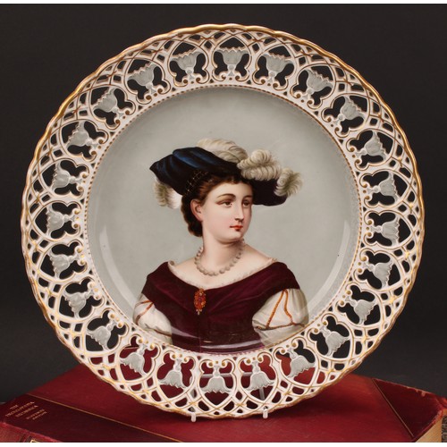 270 - A Continental porcelain shaped circular charger, painted and printed with a portrait of a young lady... 