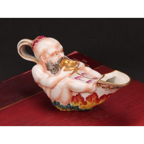 279 - A Naples porcelain inkwell, shaped as an oil lamp, moulded with a Bacchanalian reveller, painted in ... 