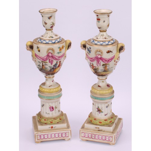 283 - A pair of Berlin porcelain cassolettes, each as a pedestal urn on column support, stepped square bas... 